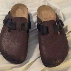 Brown and black trimmed Birkenstocks